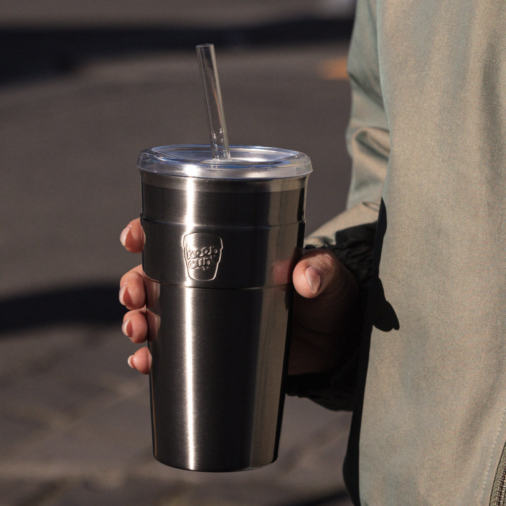 Hand holding a KeepCup Cold Cup Thermal 454ml in Nitro