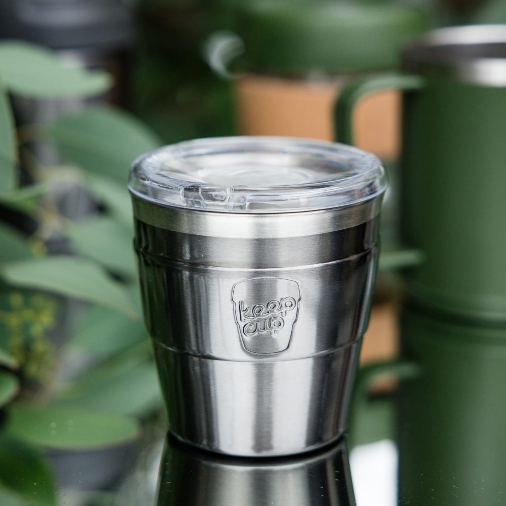 KeepCup Insulated QuickSip Espresso Cup 177ml in Nitro on a reflective surface