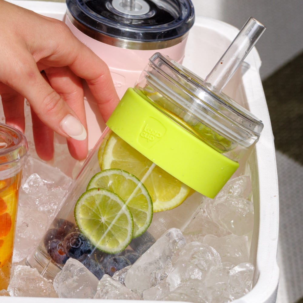 Hand taking a KeepCup Cold Cup Longplay Boba 454ml in Matcha from an ice-filled cooler