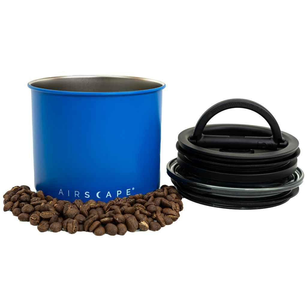 Airscape canister with plunger lid and coffee beans