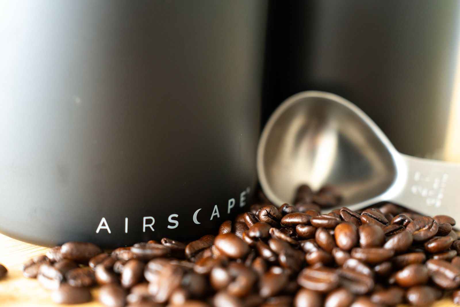 Airscape steel coffee scoop with beans and canister