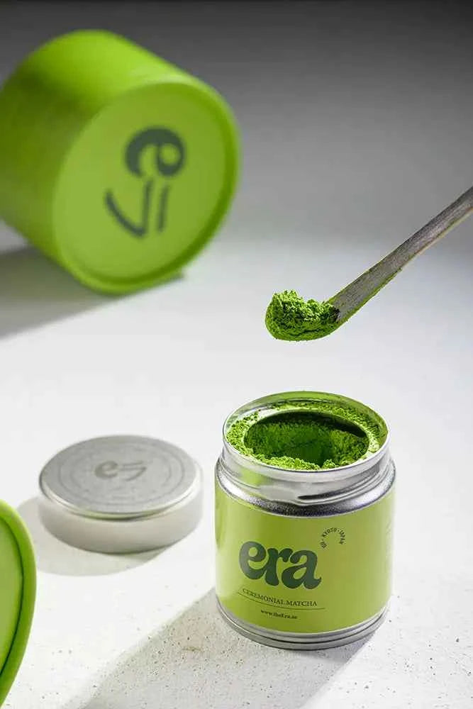 Era dark bamboo chashaku with matcha powder
