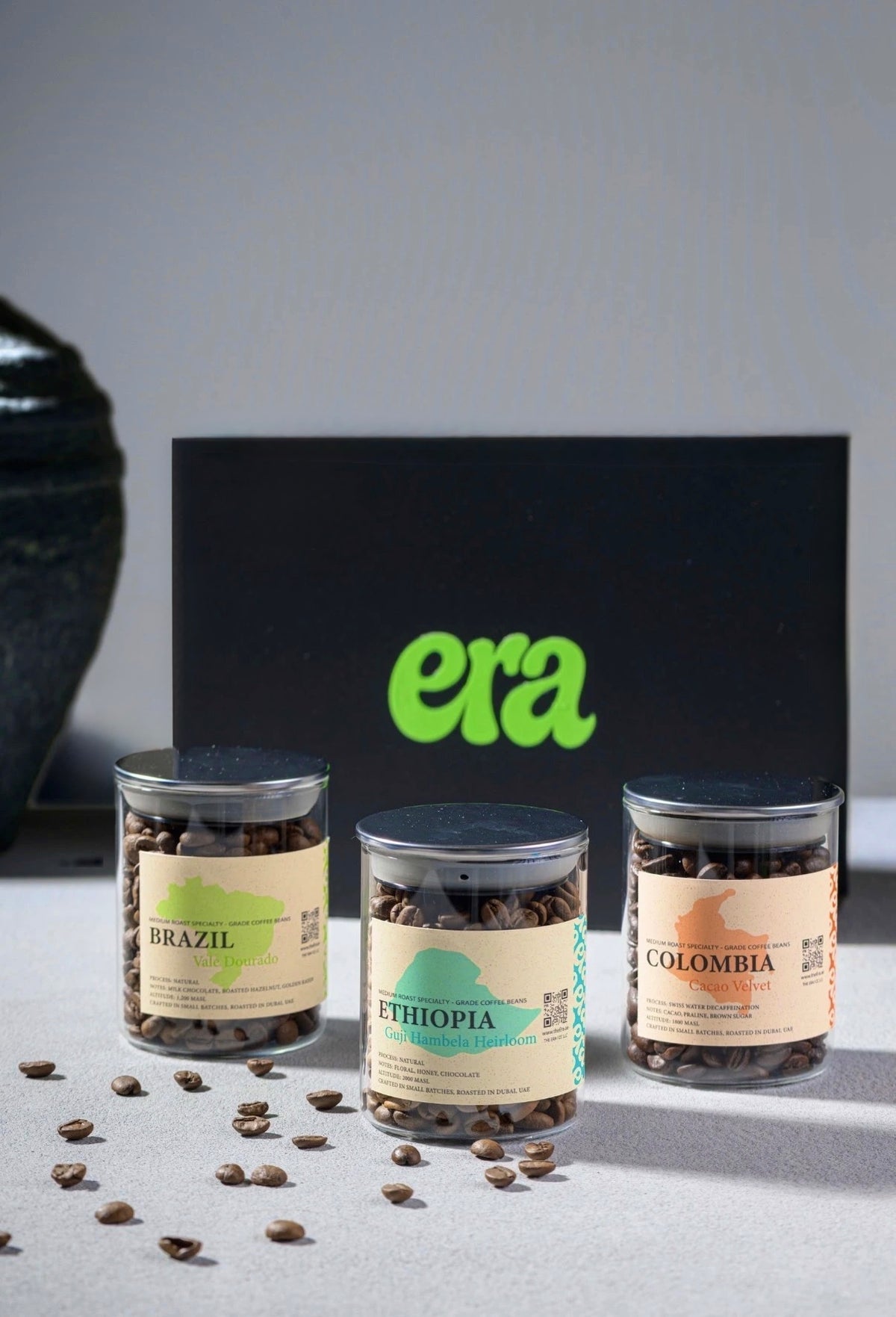 Era beans gift box - Brazil, Ethiopia, and Colombia glass jars in front of a black era box