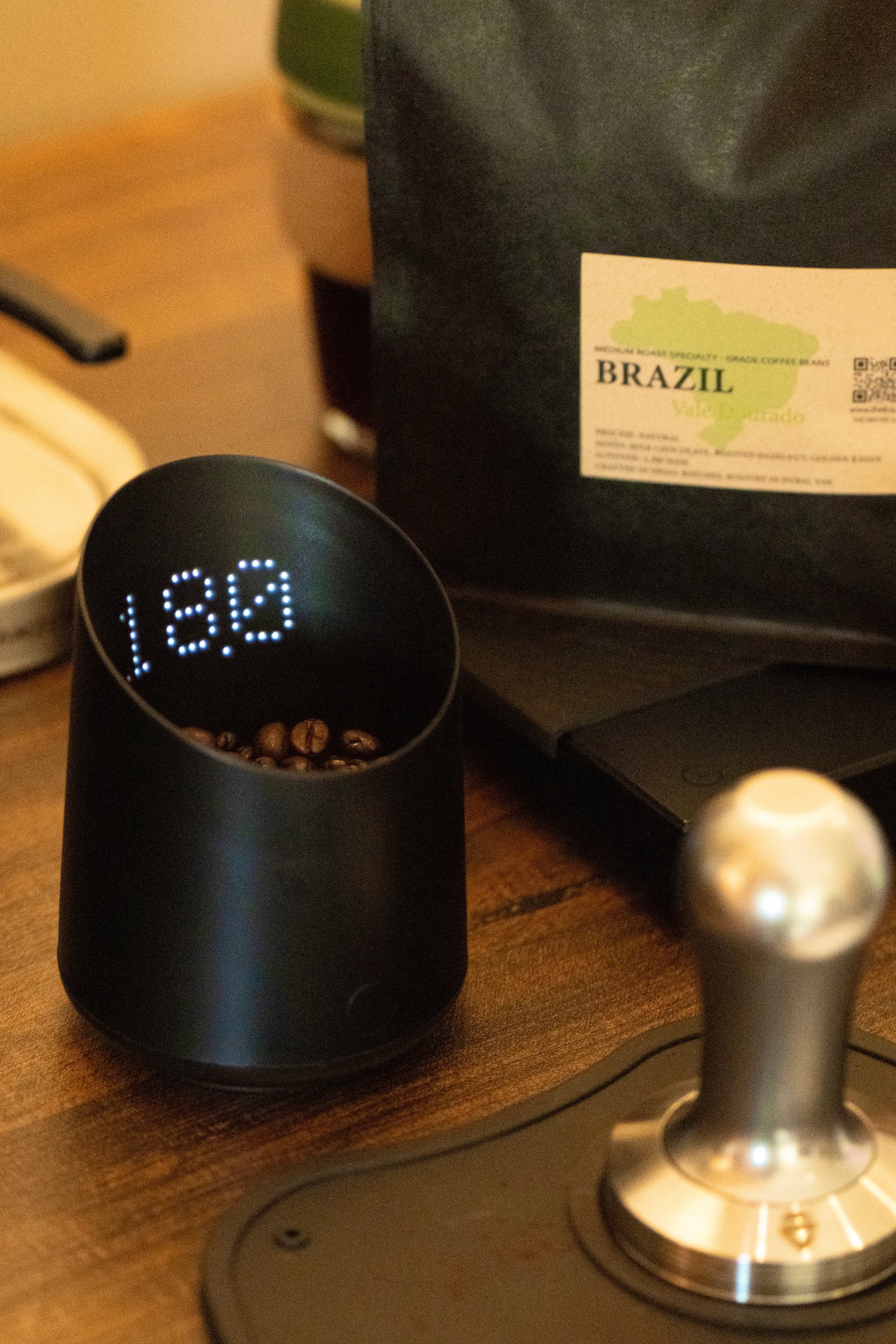 18 gram espresso dose of Era Brazil Vale Dourado beans with tamper
