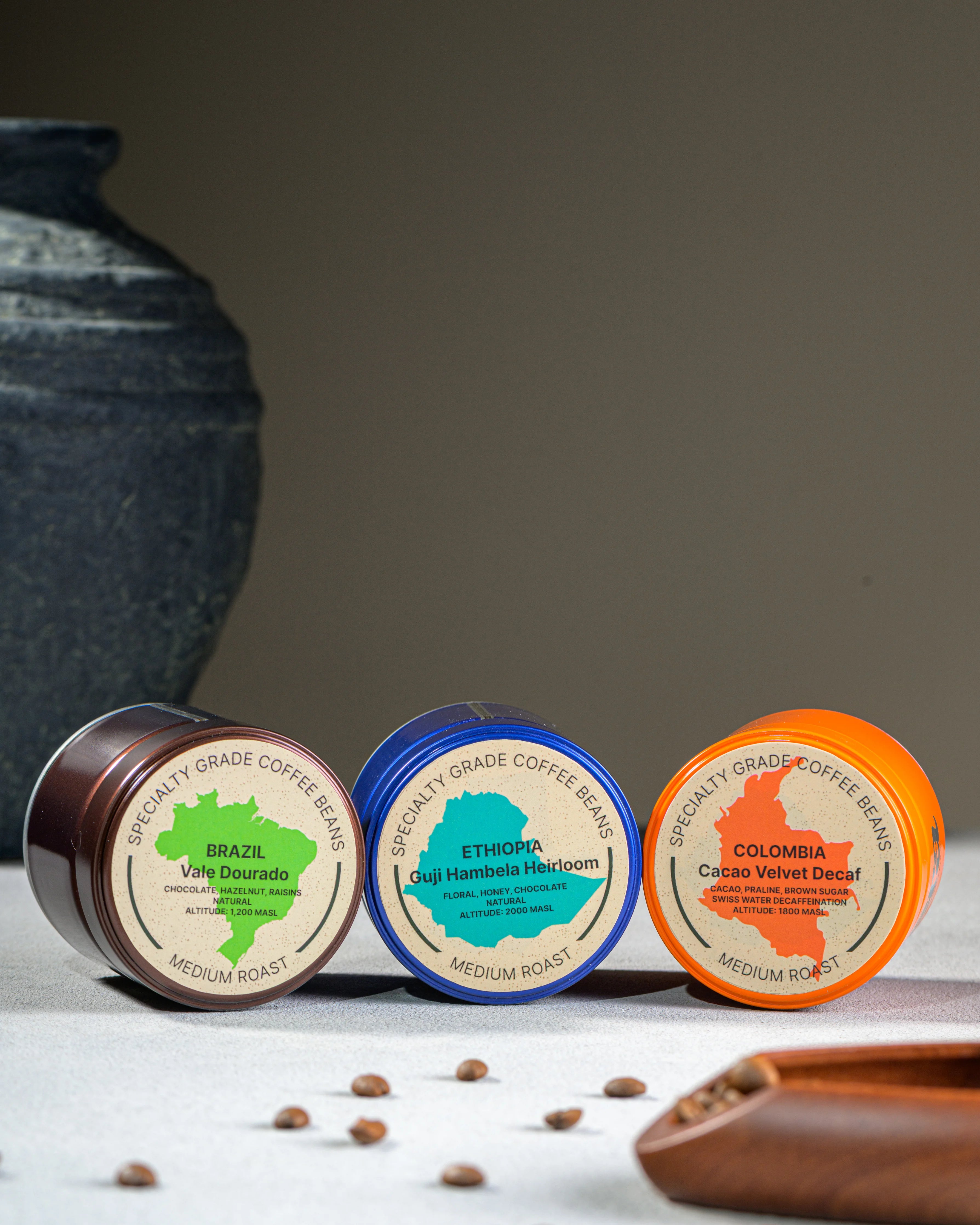 Era coffee tins for Brazil Vale Dourado, Ethiopia Guji Hambela, and Colombia Cacao Velvet Decaf