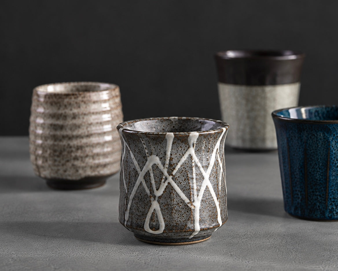 Handmade Japanese ceramic tea cups on grey stone, The Era Store Dubai