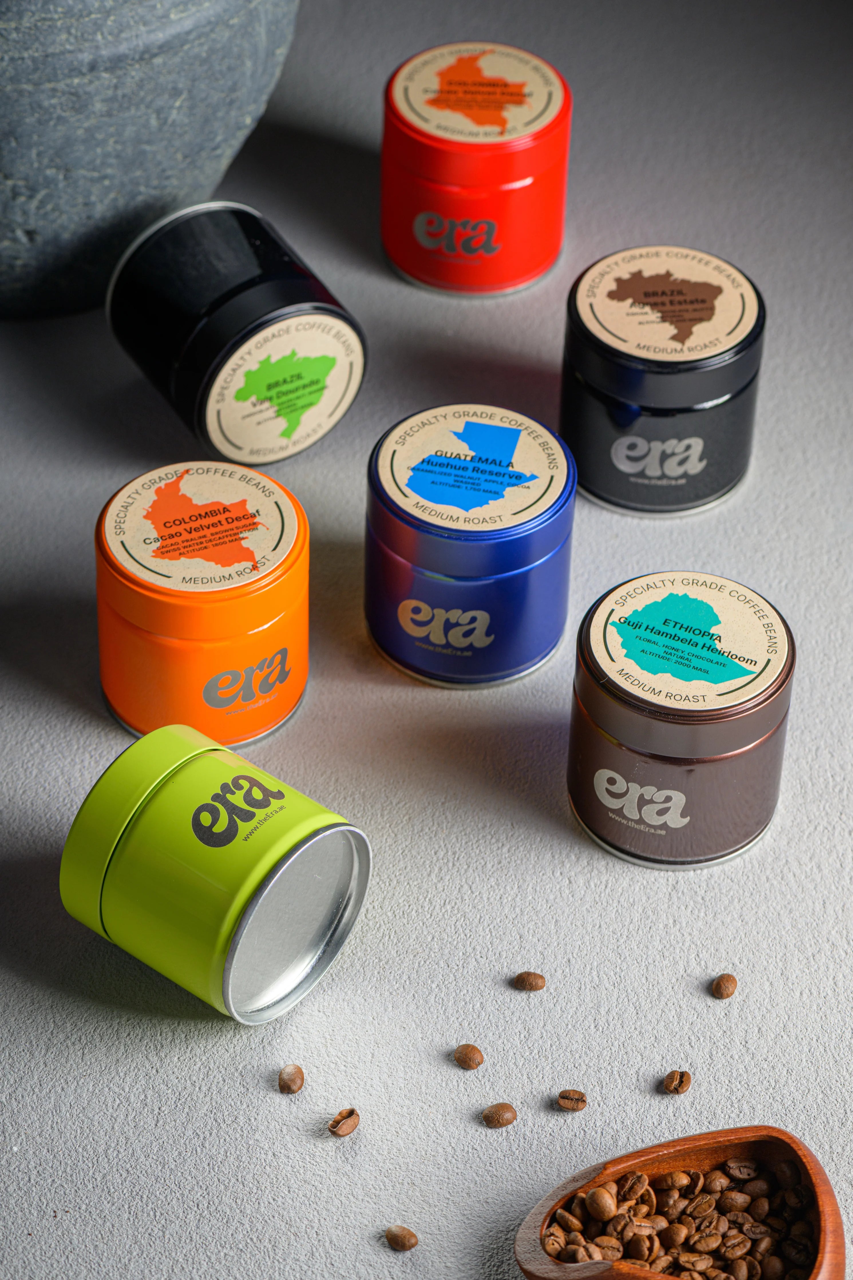 Era specialty coffee bean tins in seven colors with origin labels