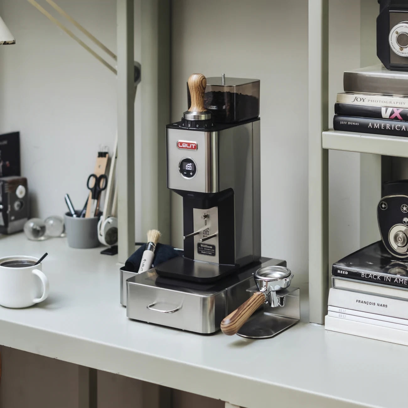 Lelit William espresso grinder in a home coffee setup with espresso tools