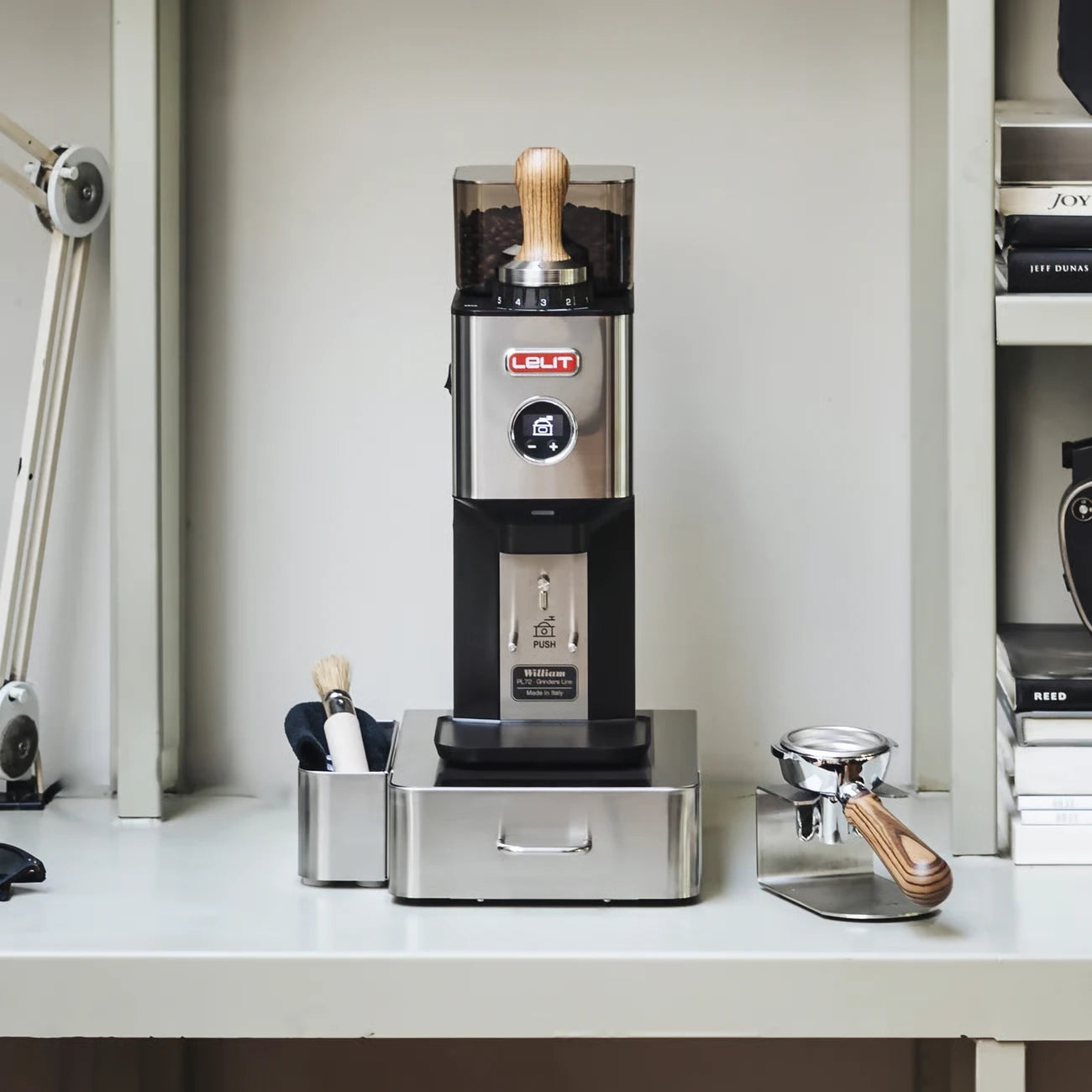 Lelit William grinder on a home coffee bar with knock box drawer and wooden tamper