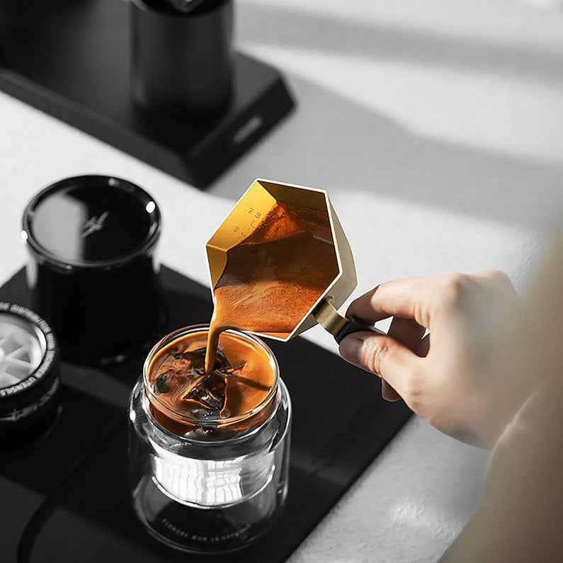 Pouring espresso from the Prism measuring cup