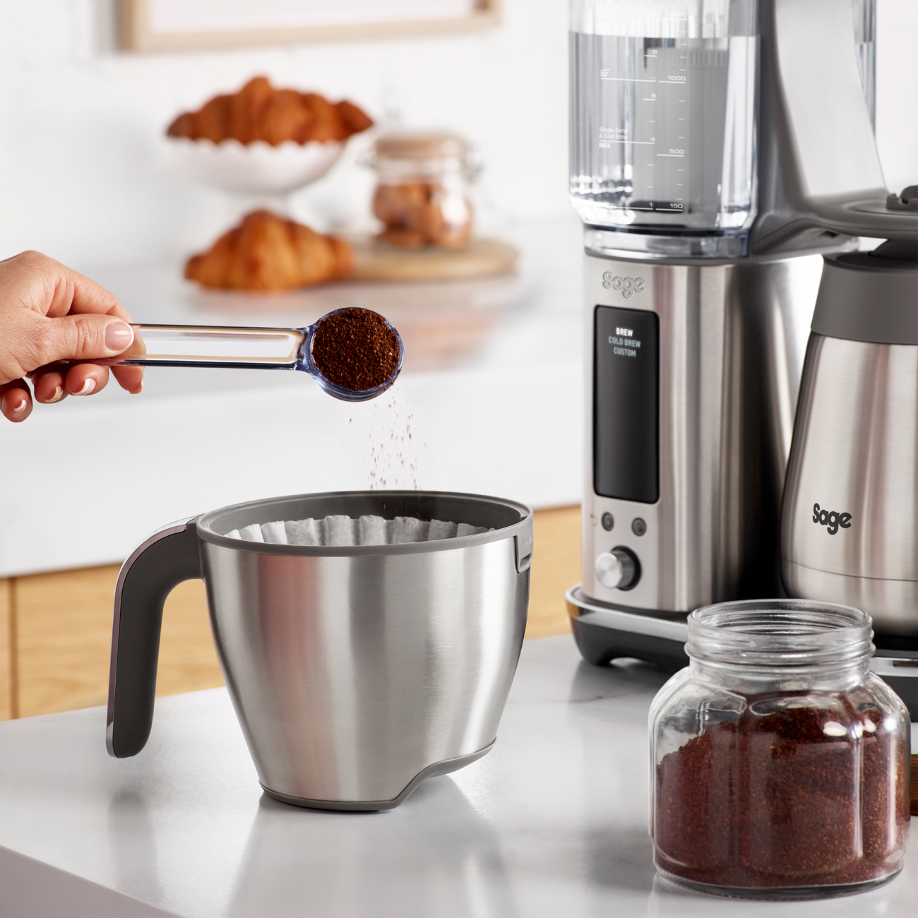 Adding ground coffee to the Sage Luxe Brewer Thermal