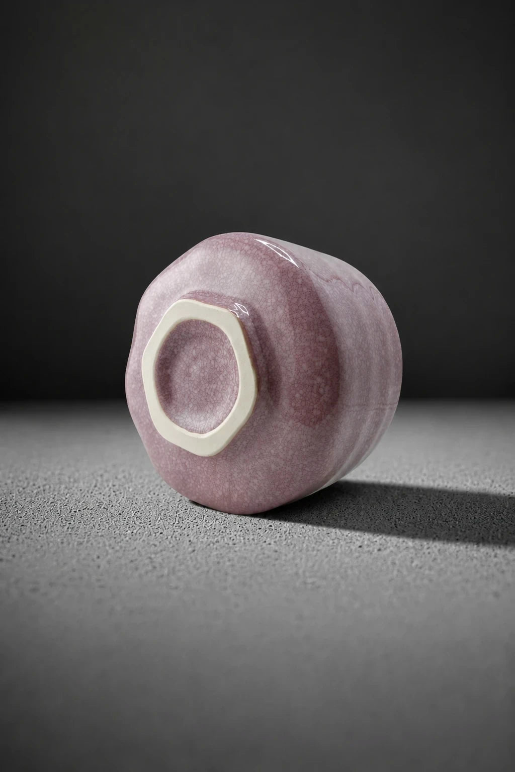 Base of Shin Fuji pink matcha bowl showing unglazed foot ring and crackle glaze detail