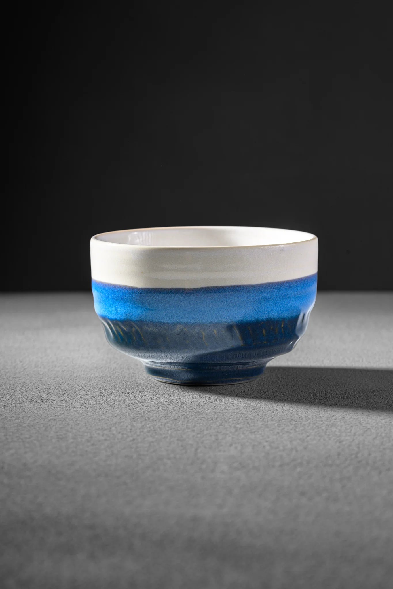 Tsuchi Series Shiranami matcha bowl - white crest over blue glaze, handmade in Japan